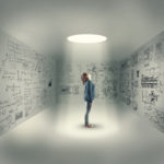 Young girl in center of a room looking up through a hole, isolated in a room with mathematical formulas written on wall