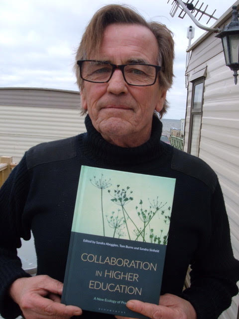 Tom Burns holding the book Collaboration in Higher Education by Sandra Abegglen (Anthology Editor) , Tom Burns (Anthology Editor) , Sandra Sinfield (Anthology Editor)